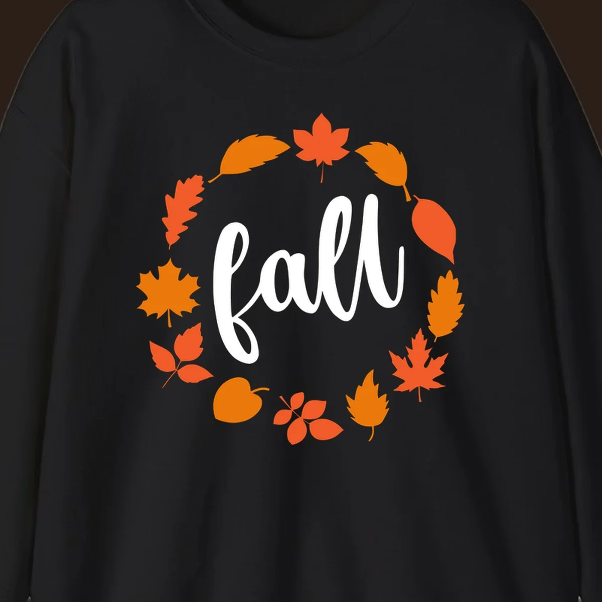 Fall leaves wreath with white script text.