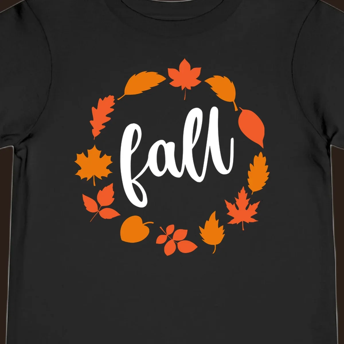Fall leaves wreath with white script text.