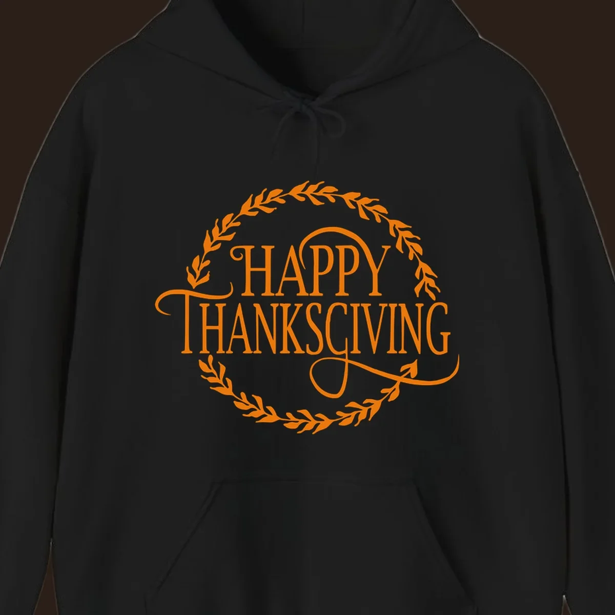 Happy Thanksgiving text with an orange leafy wreath.