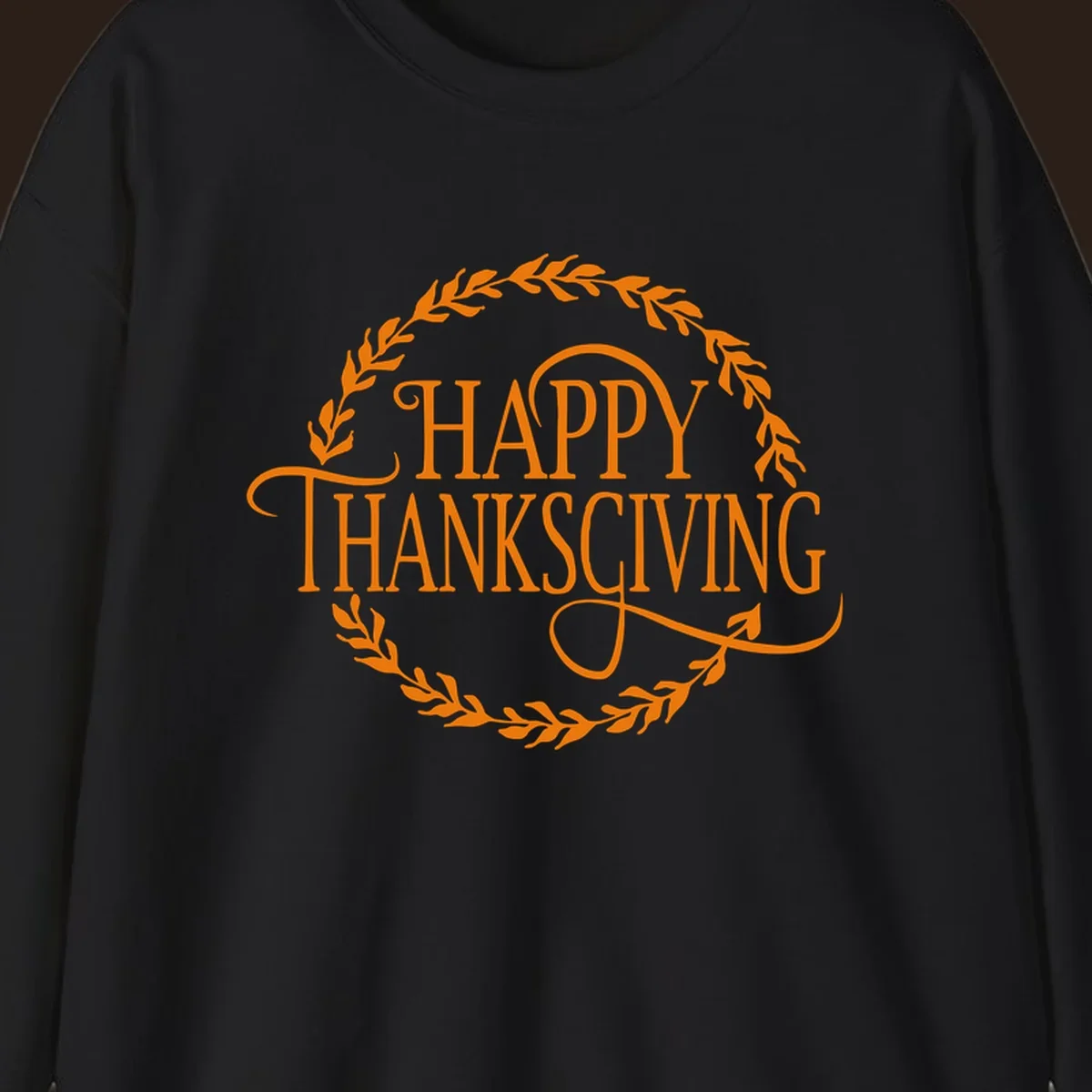 Happy Thanksgiving text with an orange leafy wreath.