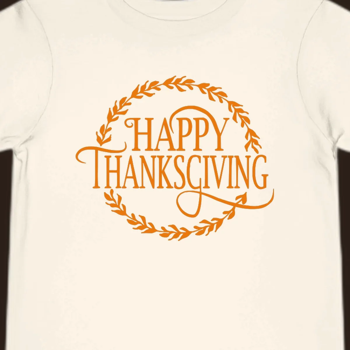 Happy Thanksgiving text with an orange leafy wreath.