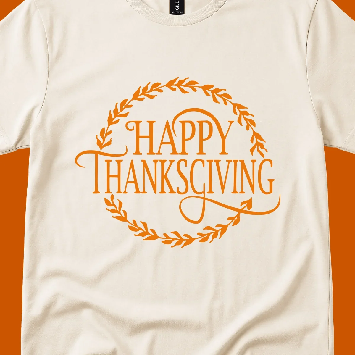 Happy Thanksgiving text with an orange leafy wreath.