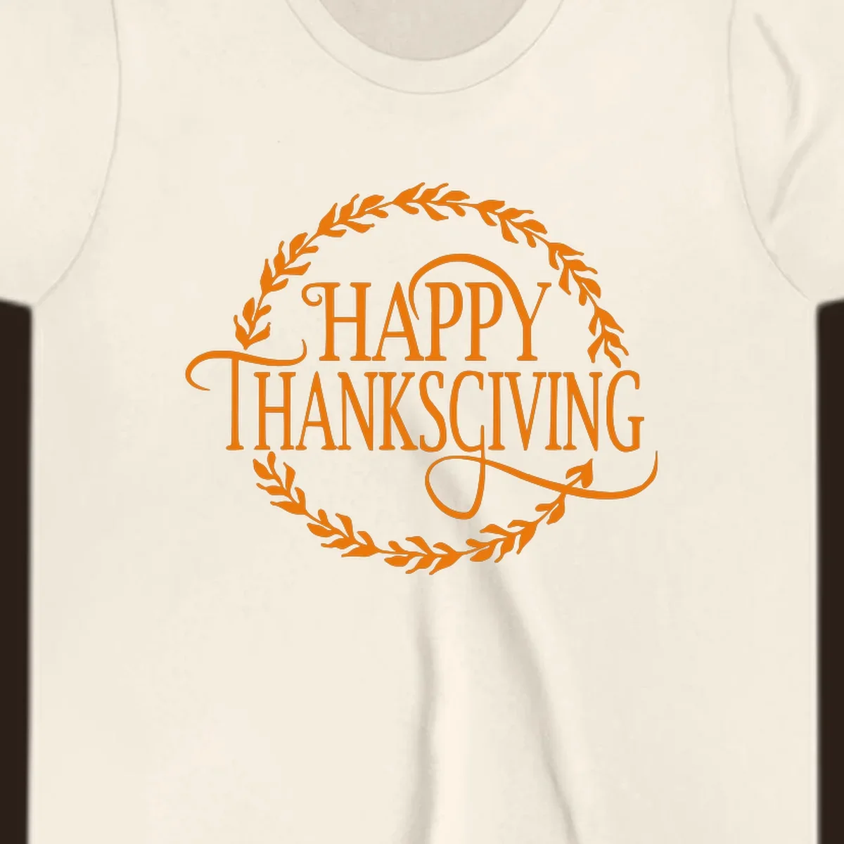 Happy Thanksgiving text with an orange leafy wreath.