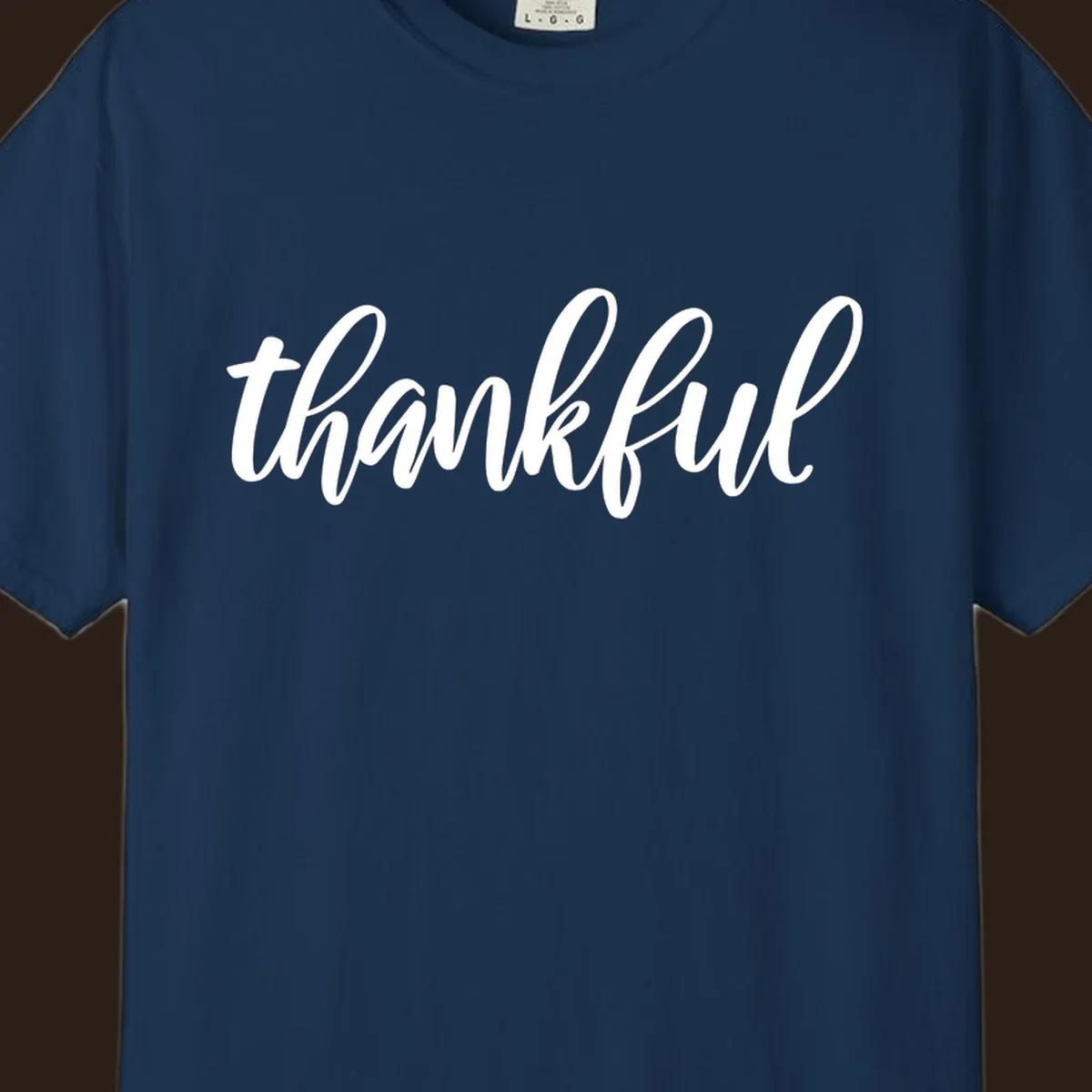 White script text spelling 'thankful' on a black background, representing thankful script word art.