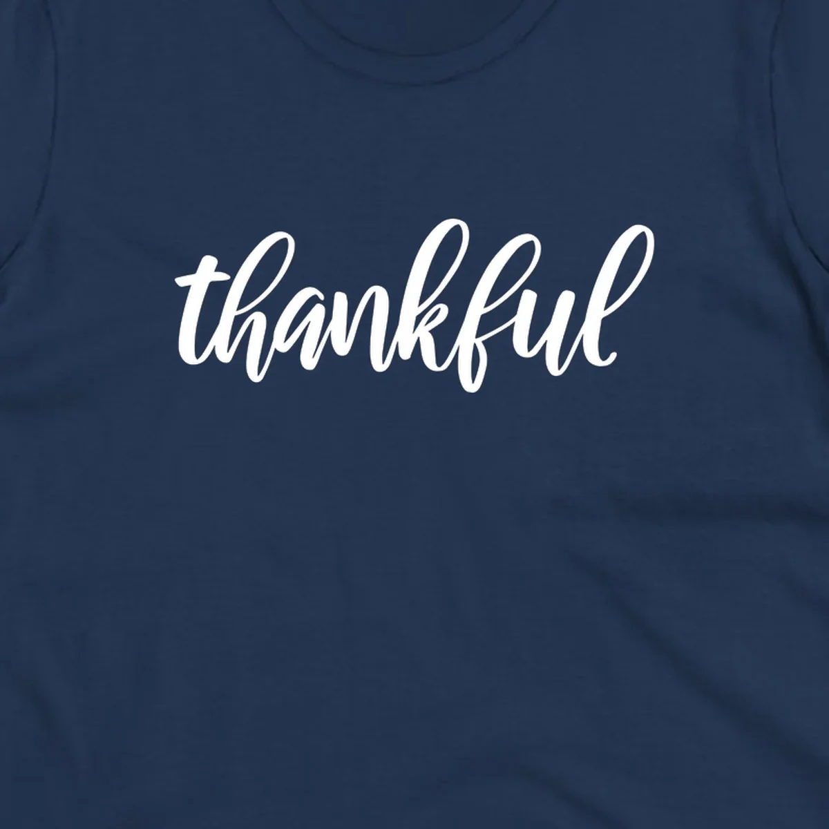 White script text spelling 'thankful' on a black background, representing thankful script word art.