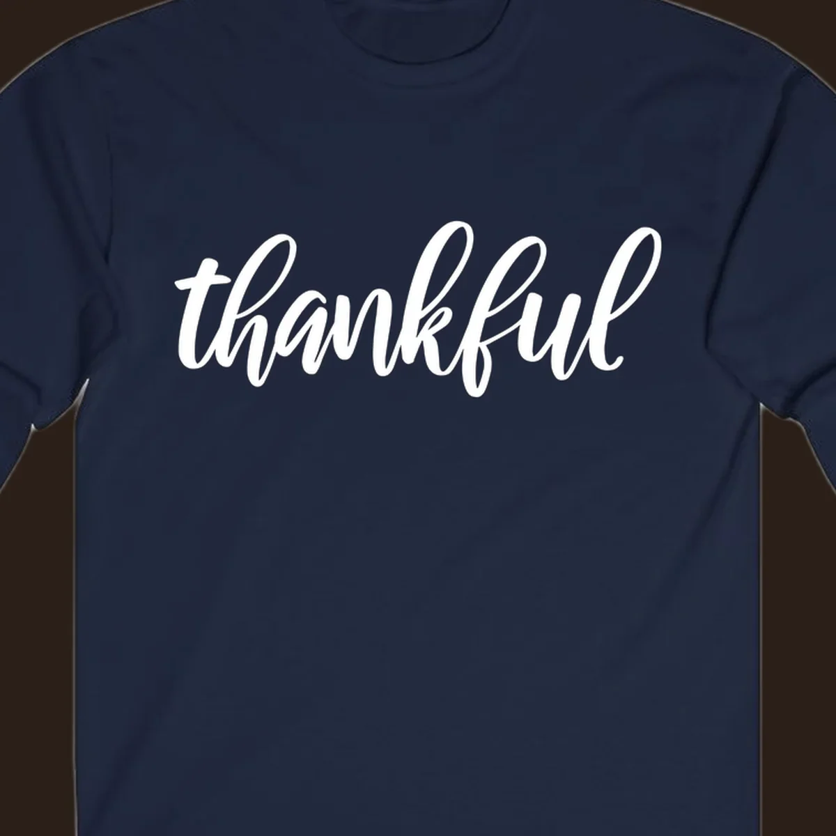 White script text spelling 'thankful' on a black background, representing thankful script word art.