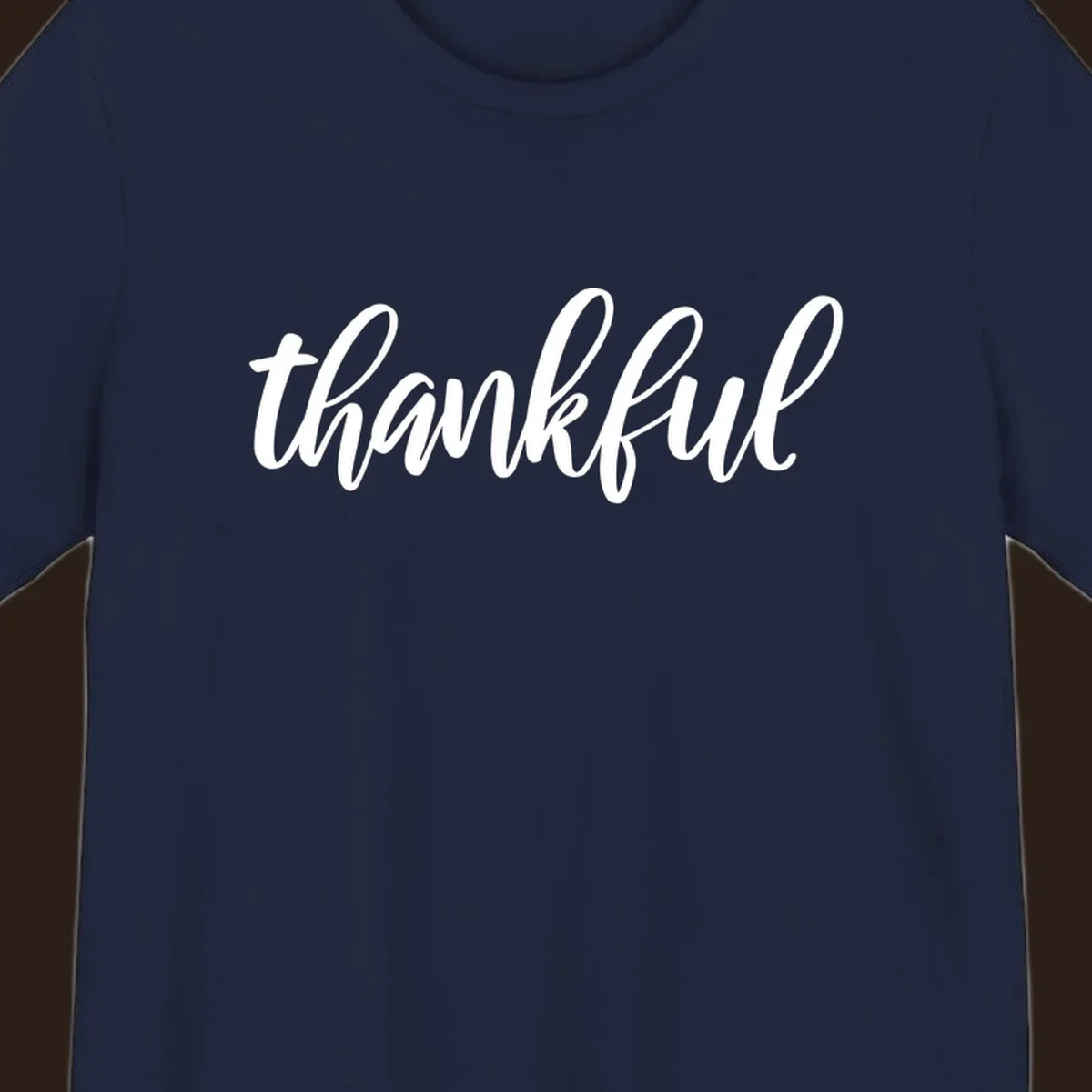 White script text spelling 'thankful' on a black background, representing thankful script word art.