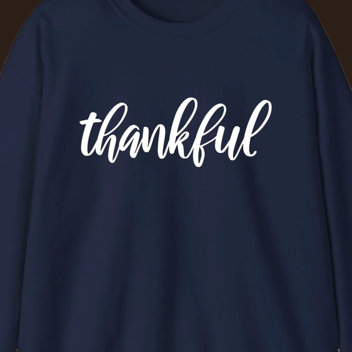 White script text spelling 'thankful' on a black background, representing thankful script word art.