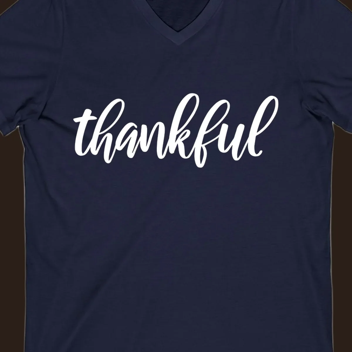 White script text spelling 'thankful' on a black background, representing thankful script word art.
