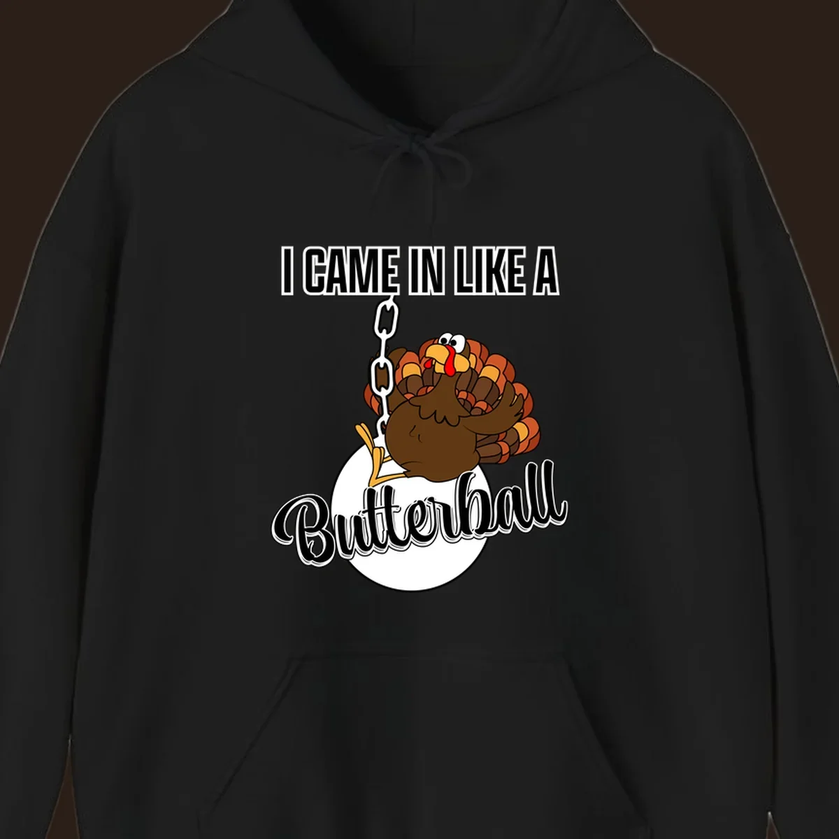 Cartoon turkey swinging from a chain like a wrecking ball with text 'I Came In Like A Butterball'.