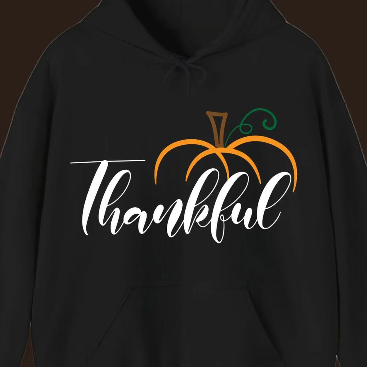 White script text 'Thankful' with a stylized orange pumpkin illustration.