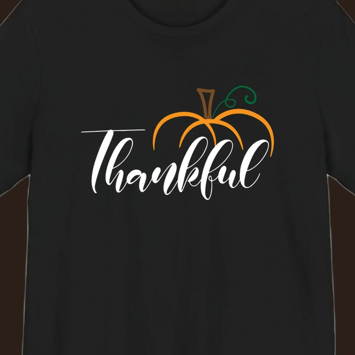 White script text 'Thankful' with a stylized orange pumpkin illustration.