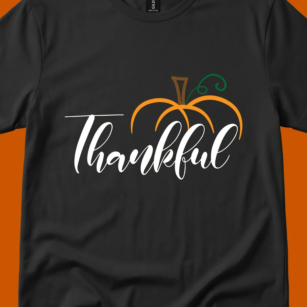 White script text 'Thankful' with a stylized orange pumpkin illustration.