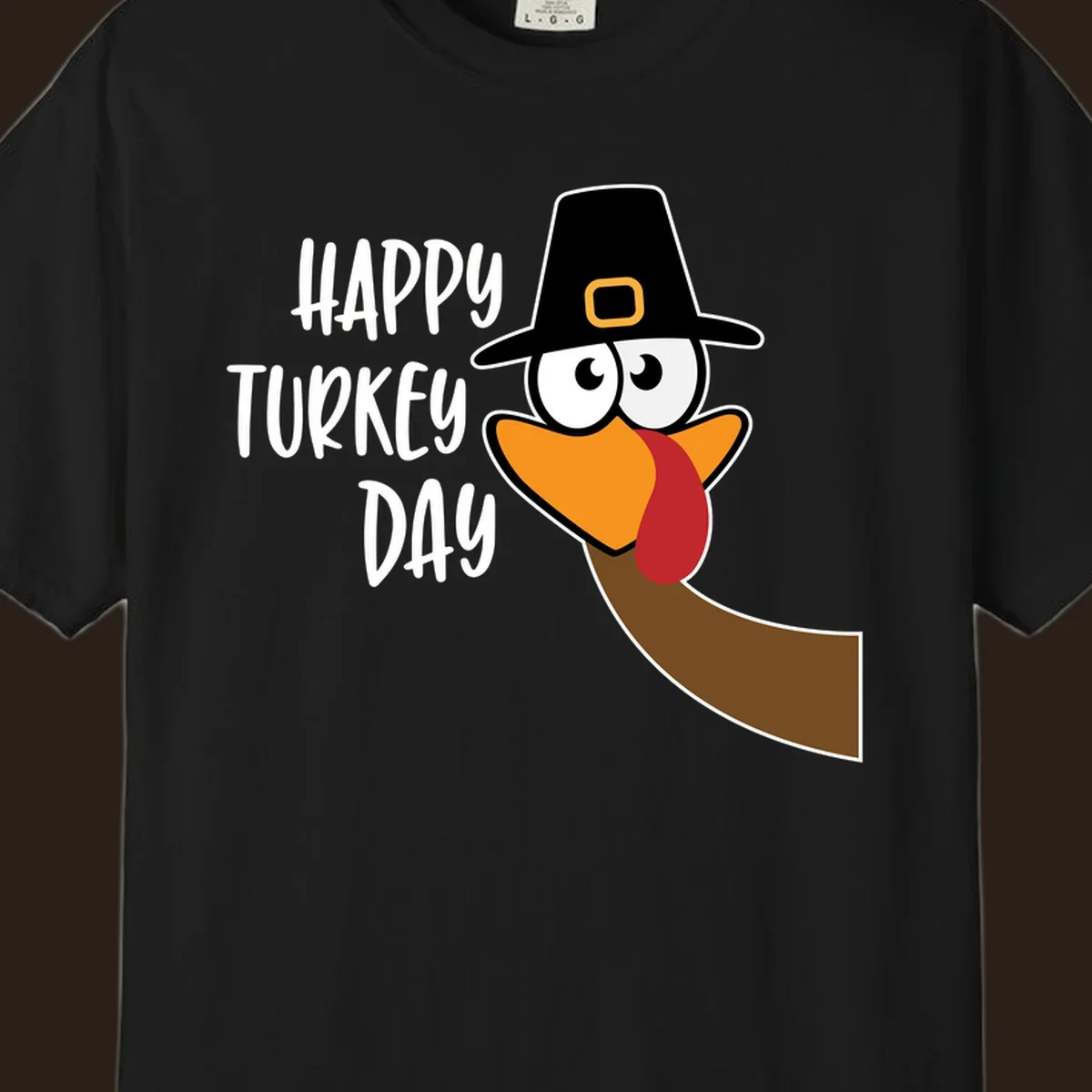 Happy Turkey Day text with a cartoon turkey wearing a pilgrim hat.