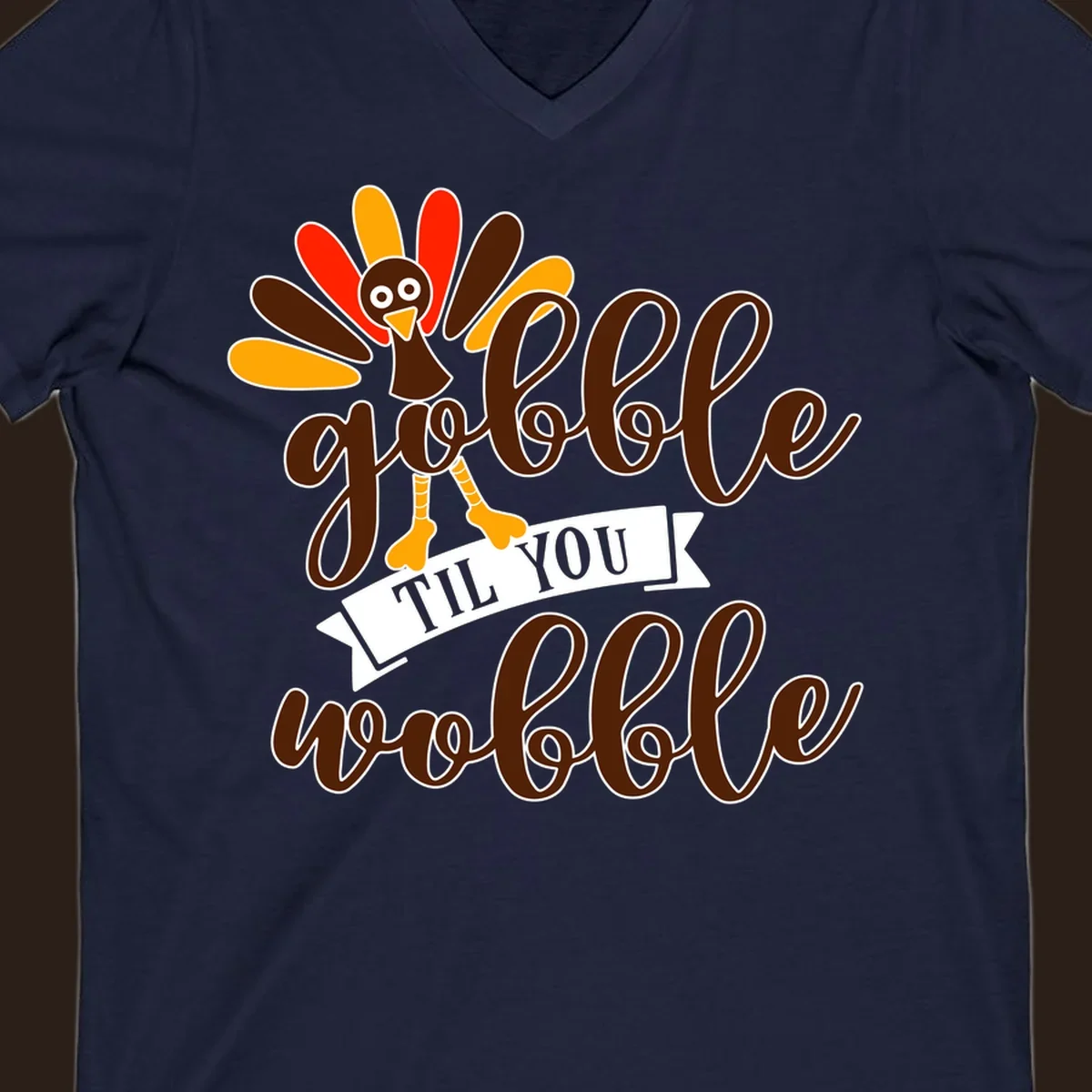 Gobble til you wobble turkey Thanksgiving illustration with colorful feathers and playful text.