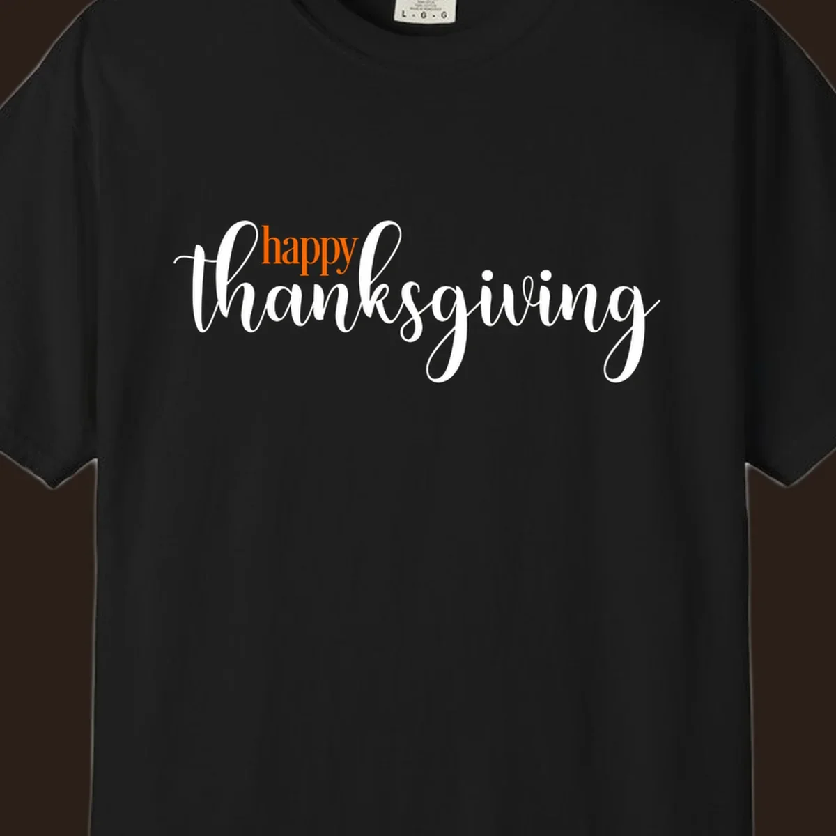 Happy Thanksgiving script design with orange 'happy' and white 'thanksgiving'.
