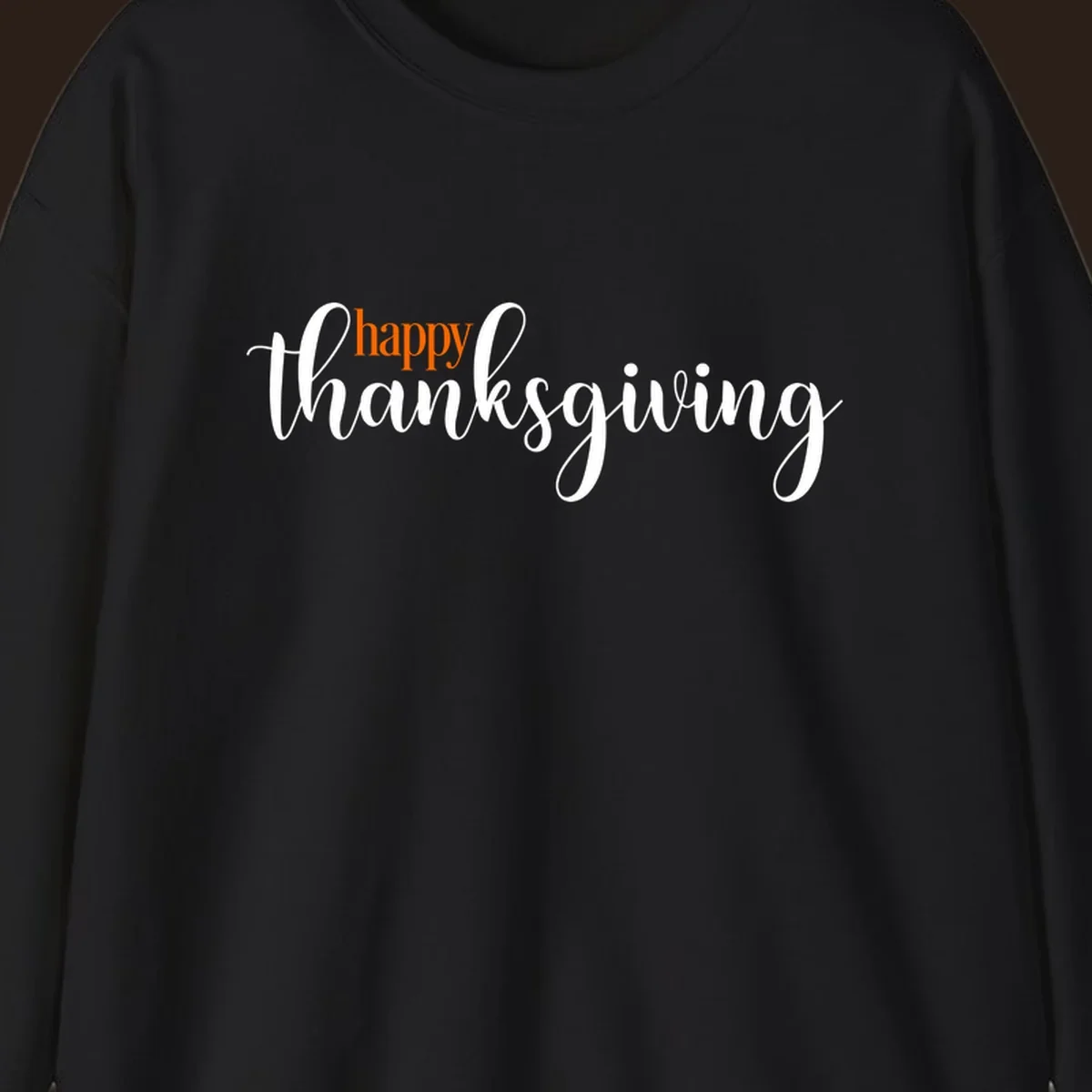 Happy Thanksgiving script design with orange 'happy' and white 'thanksgiving'.