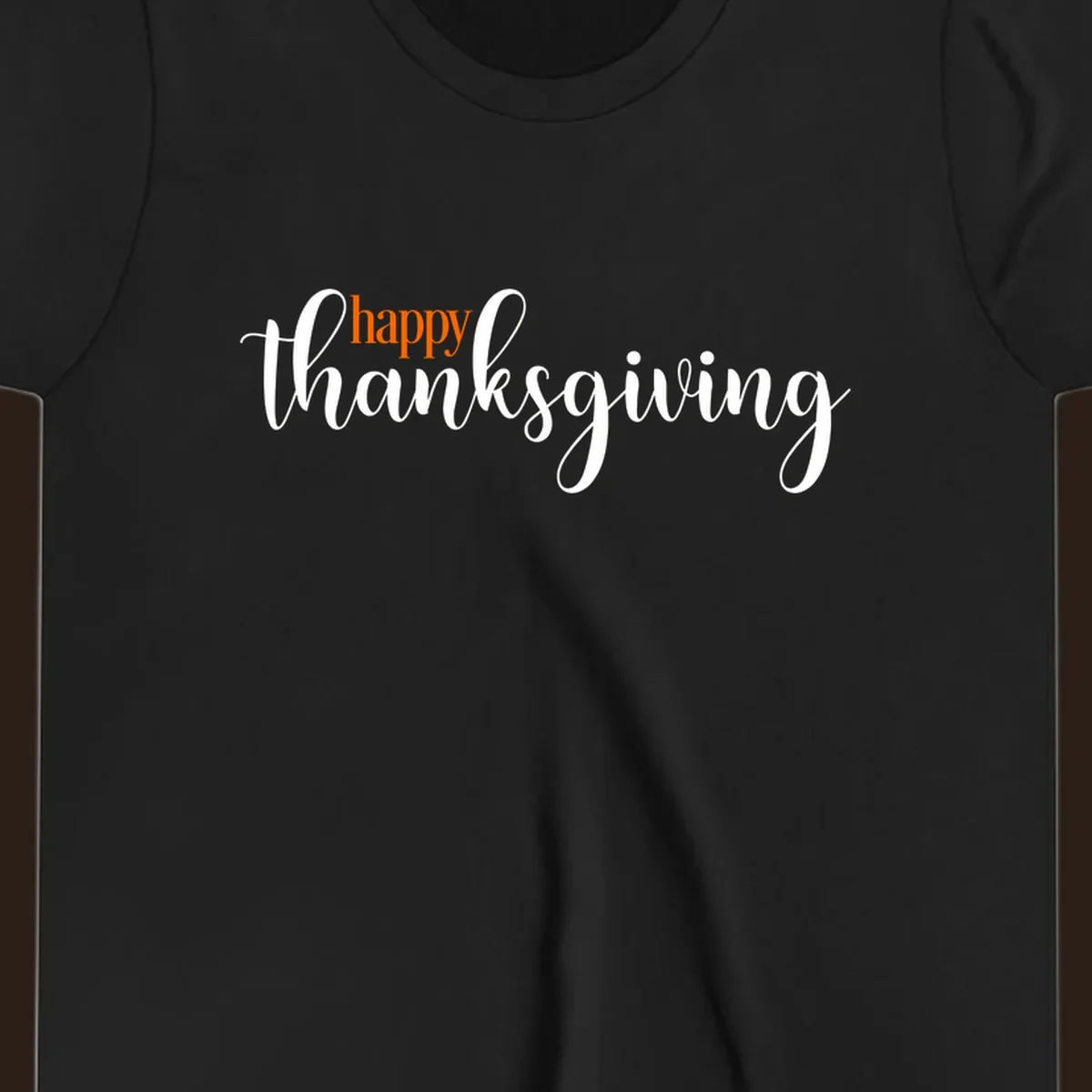 Happy Thanksgiving script design with orange 'happy' and white 'thanksgiving'.