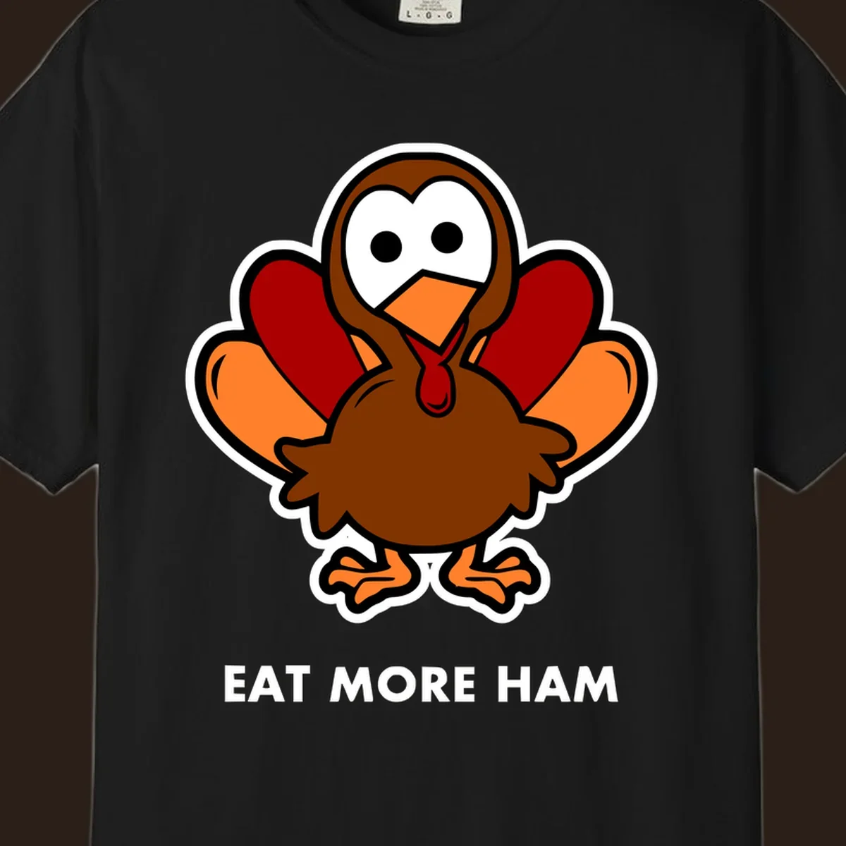 Cartoon turkey with 'Eat More Ham' text, promoting a fun Thanksgiving alternative.
