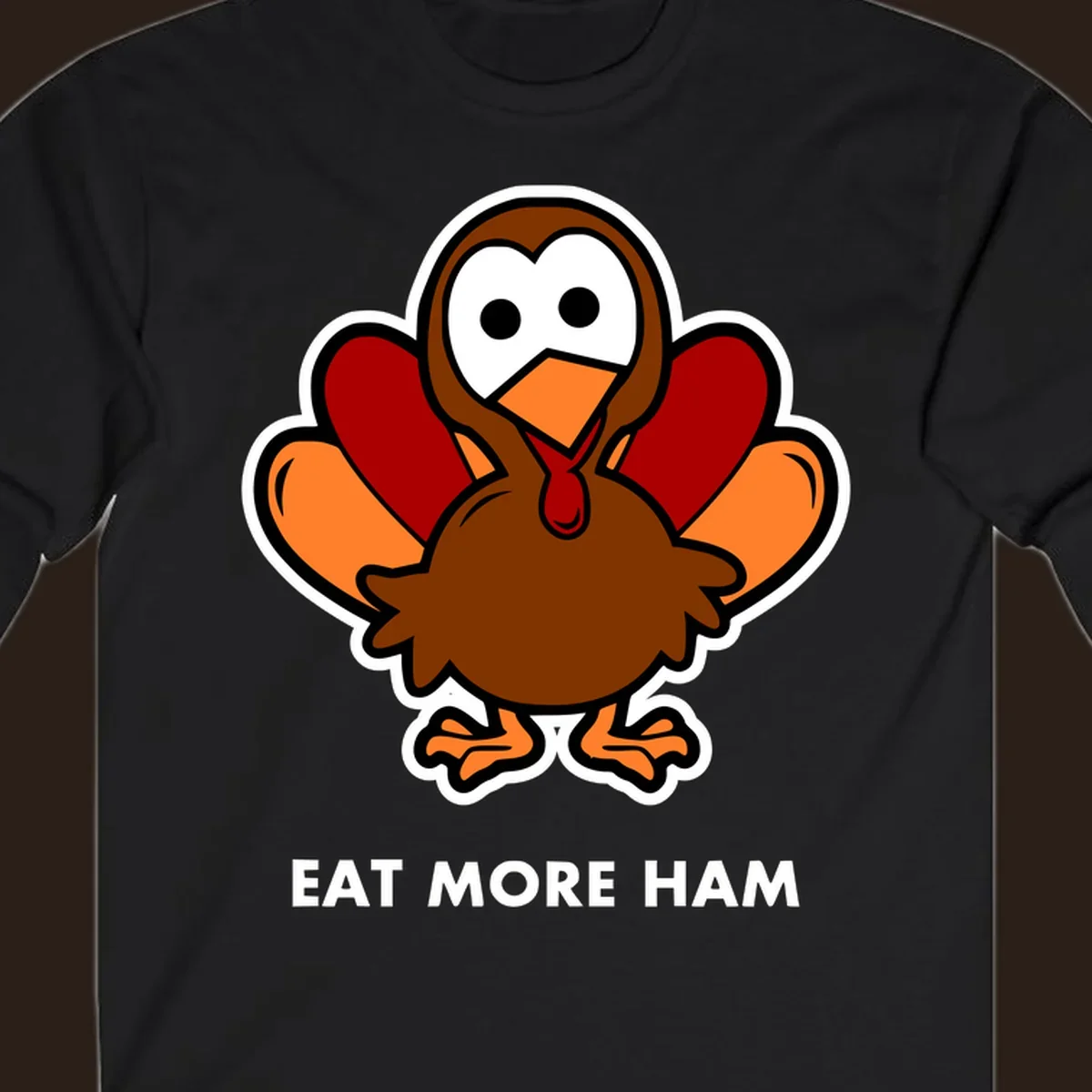 Cartoon turkey with 'Eat More Ham' text, promoting a fun Thanksgiving alternative.