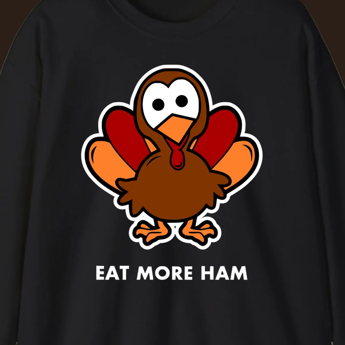 Cartoon turkey with 'Eat More Ham' text, promoting a fun Thanksgiving alternative.