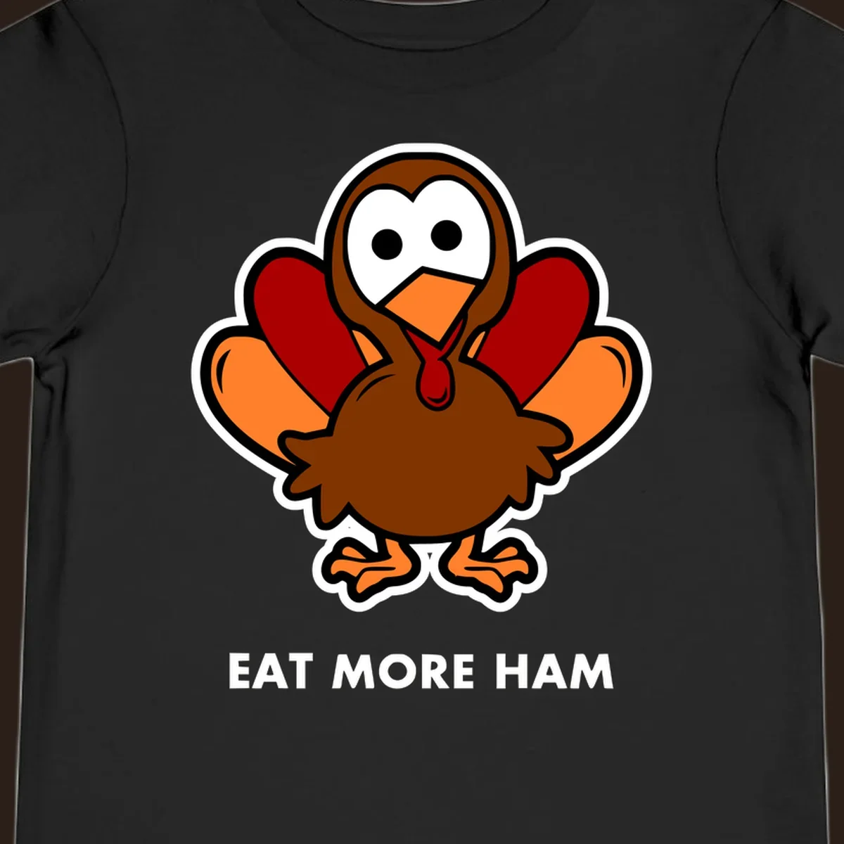 Cartoon turkey with 'Eat More Ham' text, promoting a fun Thanksgiving alternative.