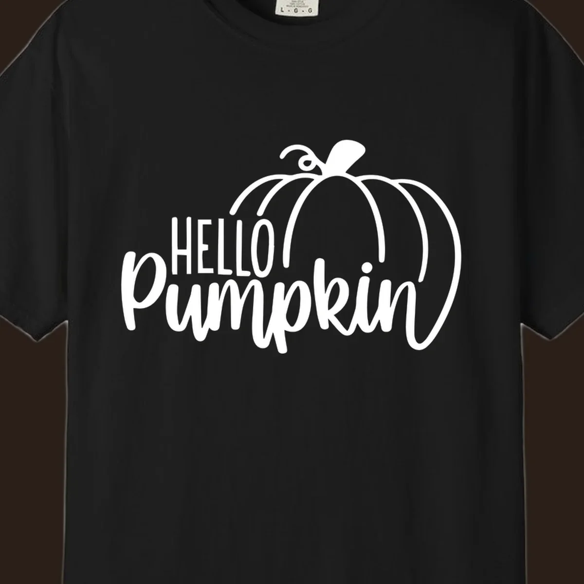 White hello pumpkin text with a pumpkin illustration, autumn holiday design