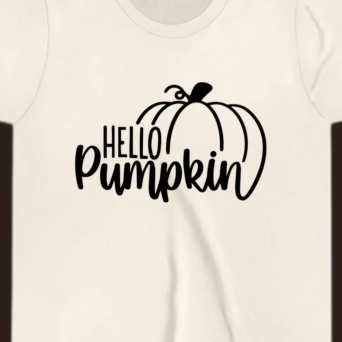 White hello pumpkin text with a pumpkin illustration, autumn holiday design