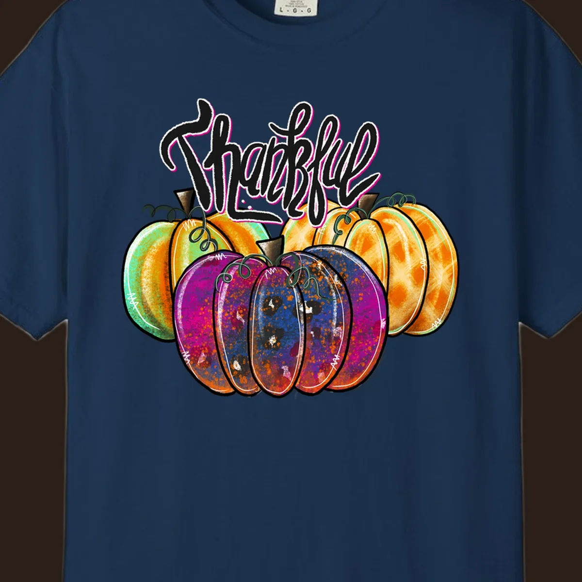 Fall pumpkin patch thankful script design. Colorful pumpkins with text.