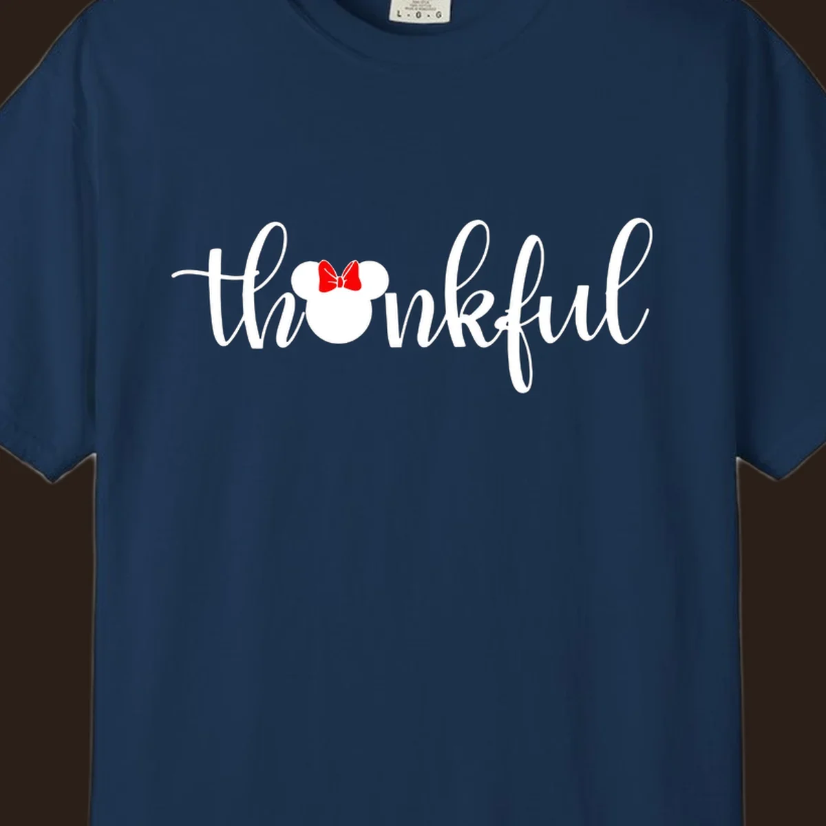 Minnie Mouse silhouette replaces the 'o' in the word 'thankful' in a script font.