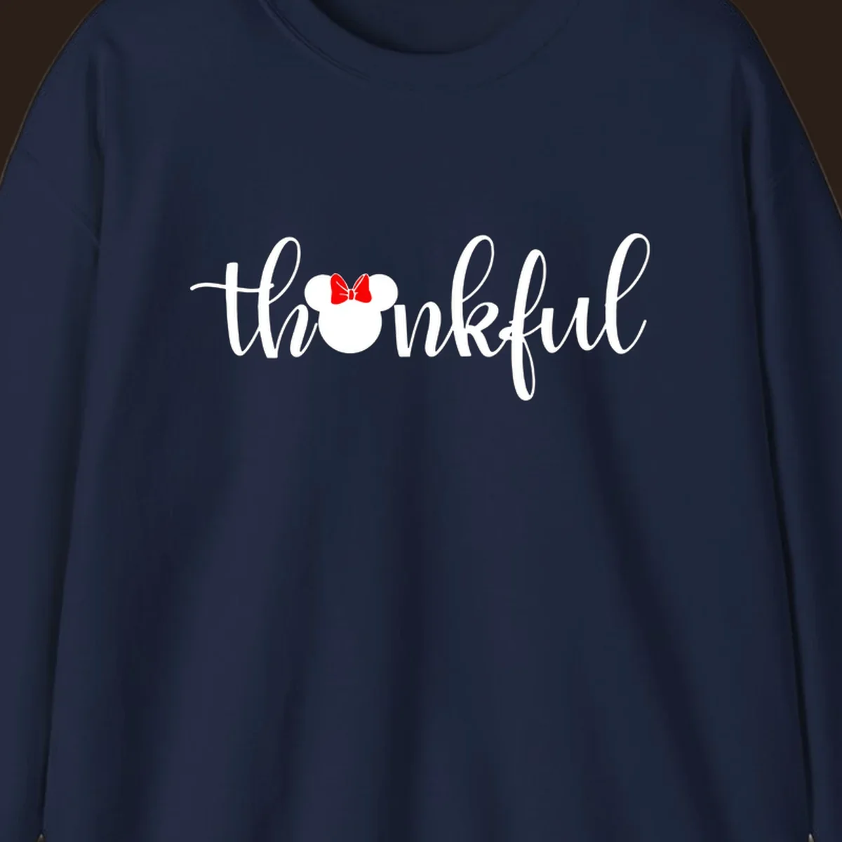 Minnie Mouse silhouette replaces the 'o' in the word 'thankful' in a script font.