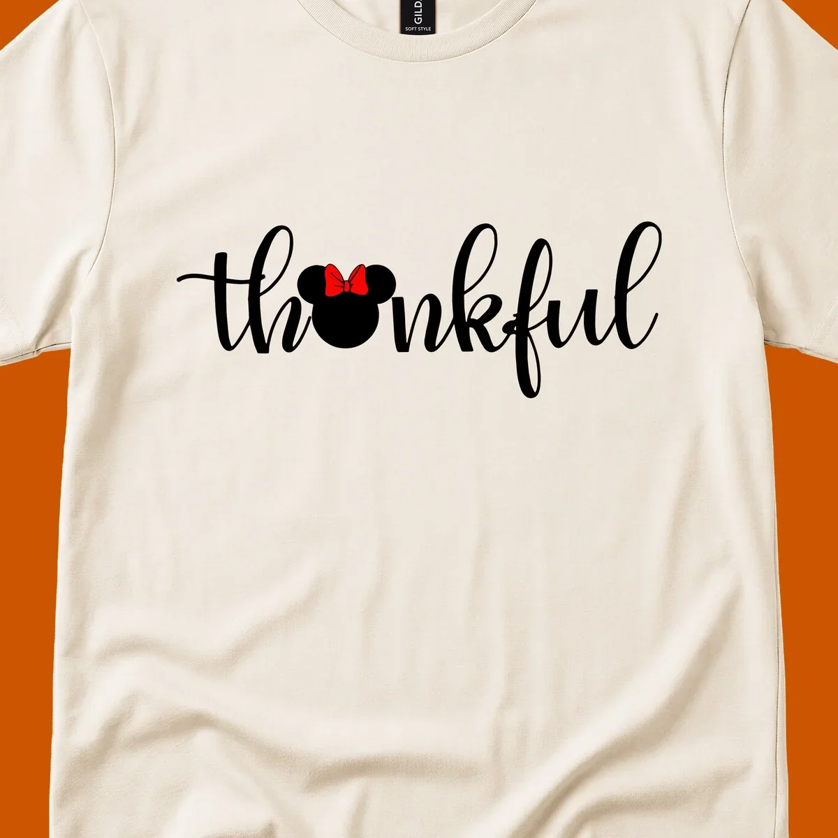 Minnie Mouse silhouette replaces the 'o' in the word 'thankful' in a script font.