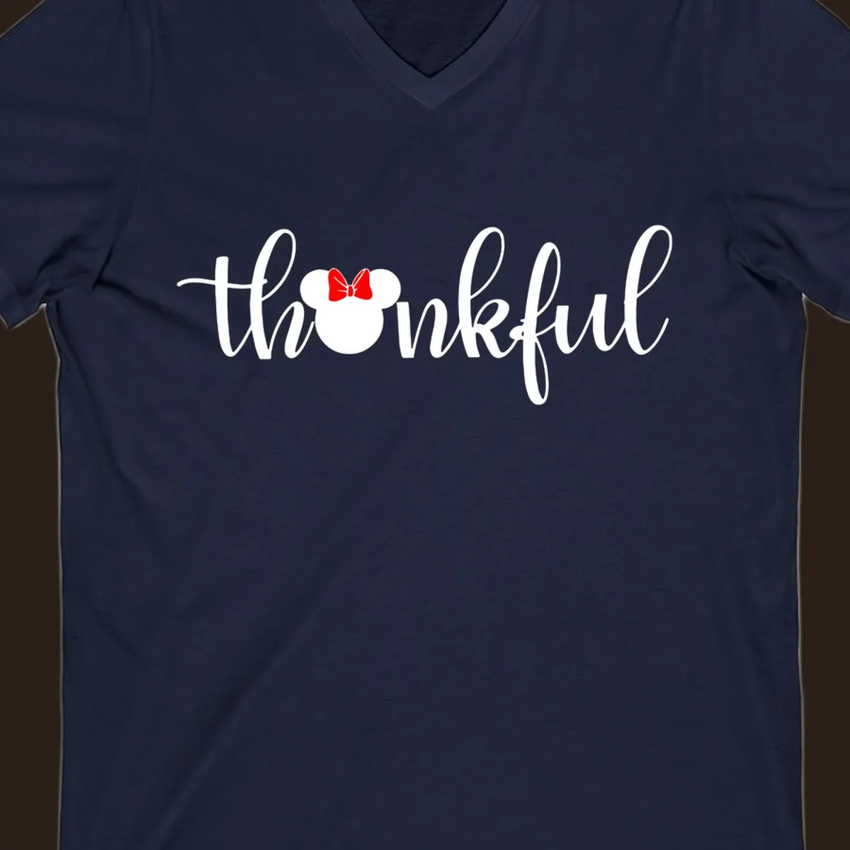 Minnie Mouse silhouette replaces the 'o' in the word 'thankful' in a script font.