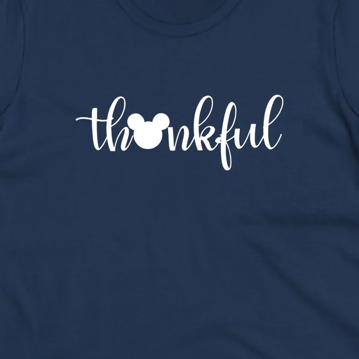 Script text 'thankful' with Mickey Mouse head silhouette replacing the 'o', in white and black variants.