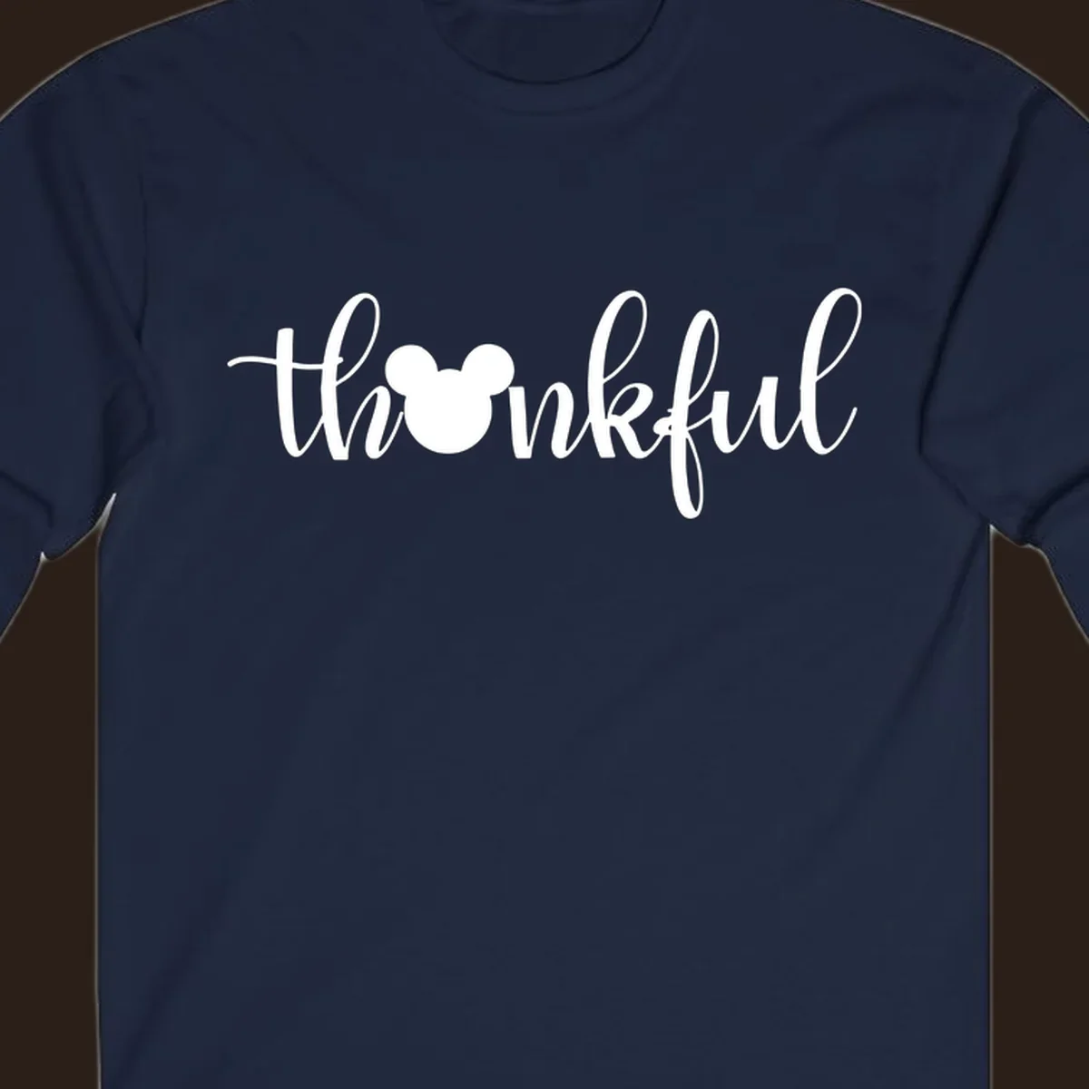 Script text 'thankful' with Mickey Mouse head silhouette replacing the 'o', in white and black variants.