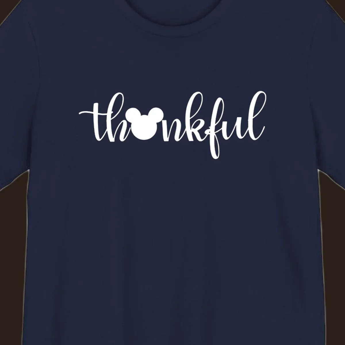 Script text 'thankful' with Mickey Mouse head silhouette replacing the 'o', in white and black variants.