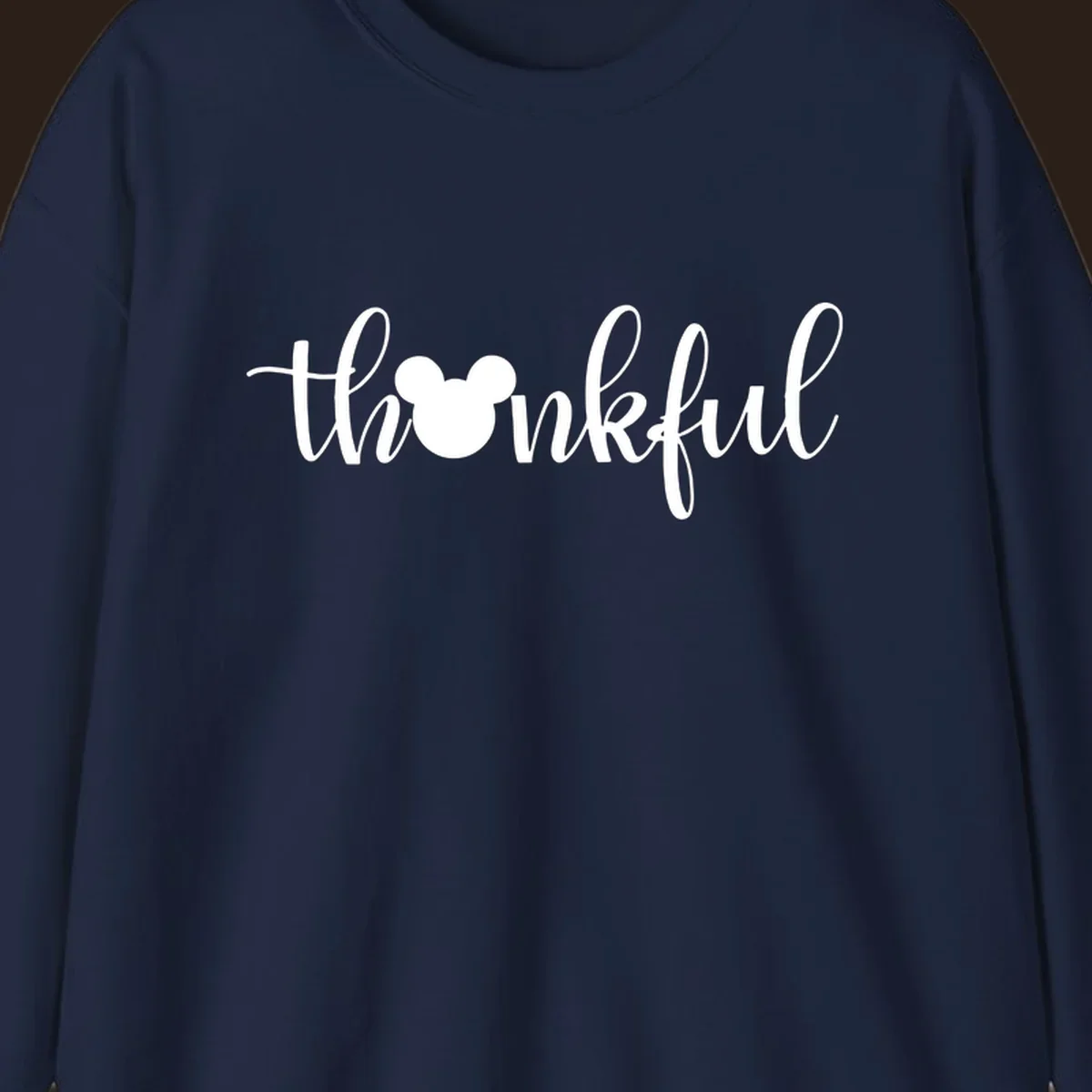 Script text 'thankful' with Mickey Mouse head silhouette replacing the 'o', in white and black variants.