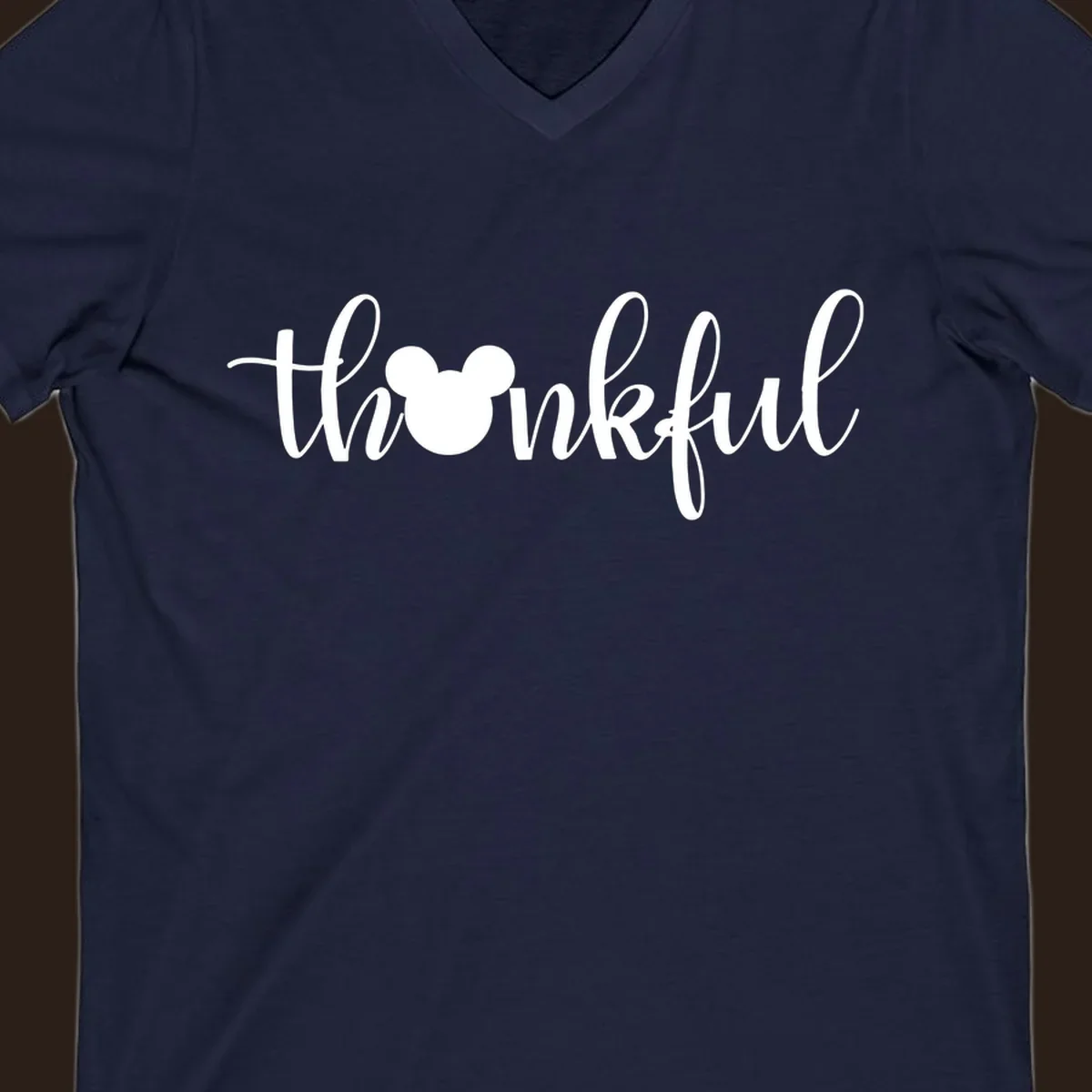 Script text 'thankful' with Mickey Mouse head silhouette replacing the 'o', in white and black variants.