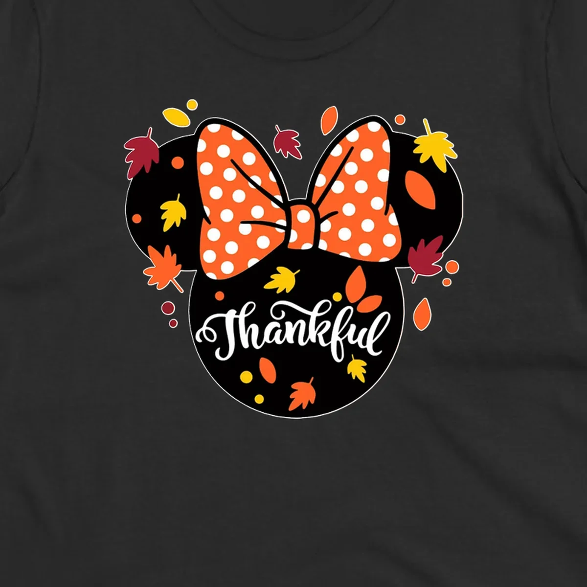 Minnie Mouse silhouette with polka dot bow and fall leaves, text reads Thankful.