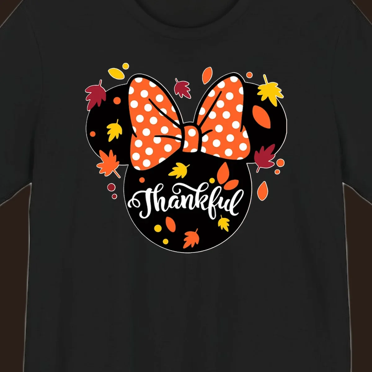 Minnie Mouse silhouette with polka dot bow and fall leaves, text reads Thankful.