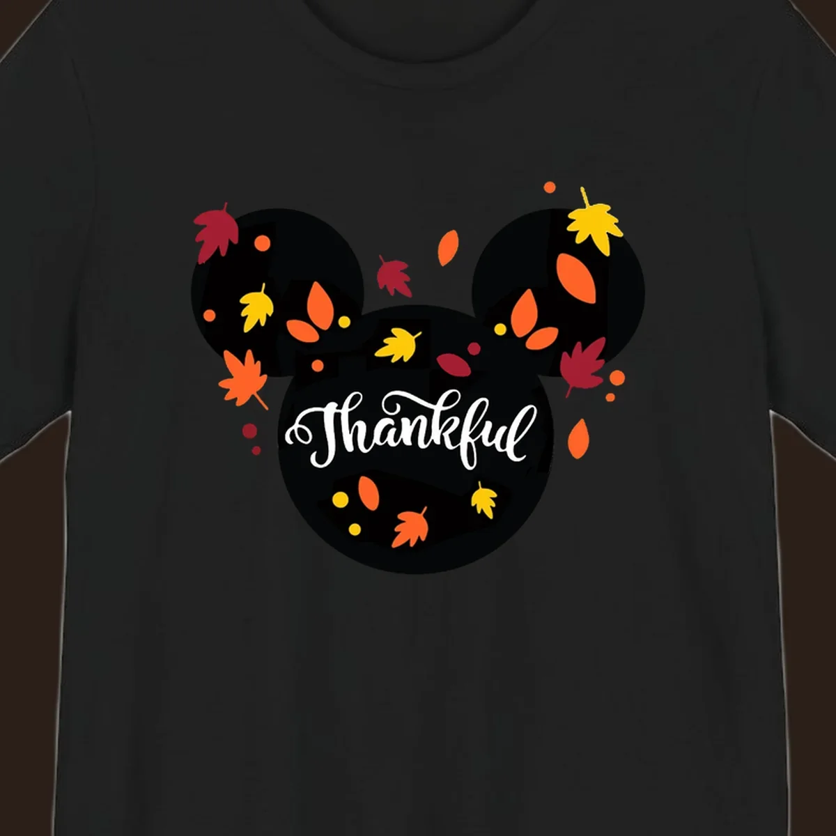 Mickey mouse head silhouette with 'Thankful' text and fall leaves, for thanksgiving shirts.