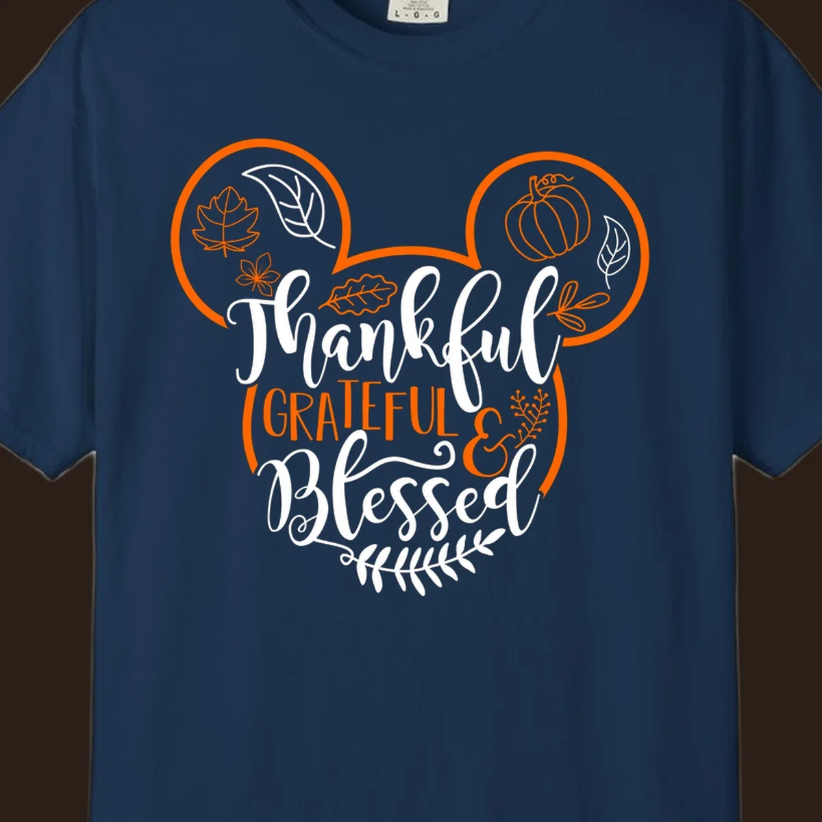 Thanksgiving Mickey Mouse head design with text Thankful GRATEFUL & Blessed and fall icons.