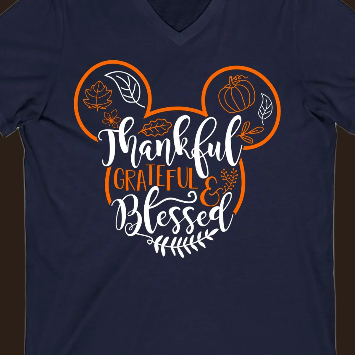 Thanksgiving Mickey Mouse head design with text Thankful GRATEFUL & Blessed and fall icons.