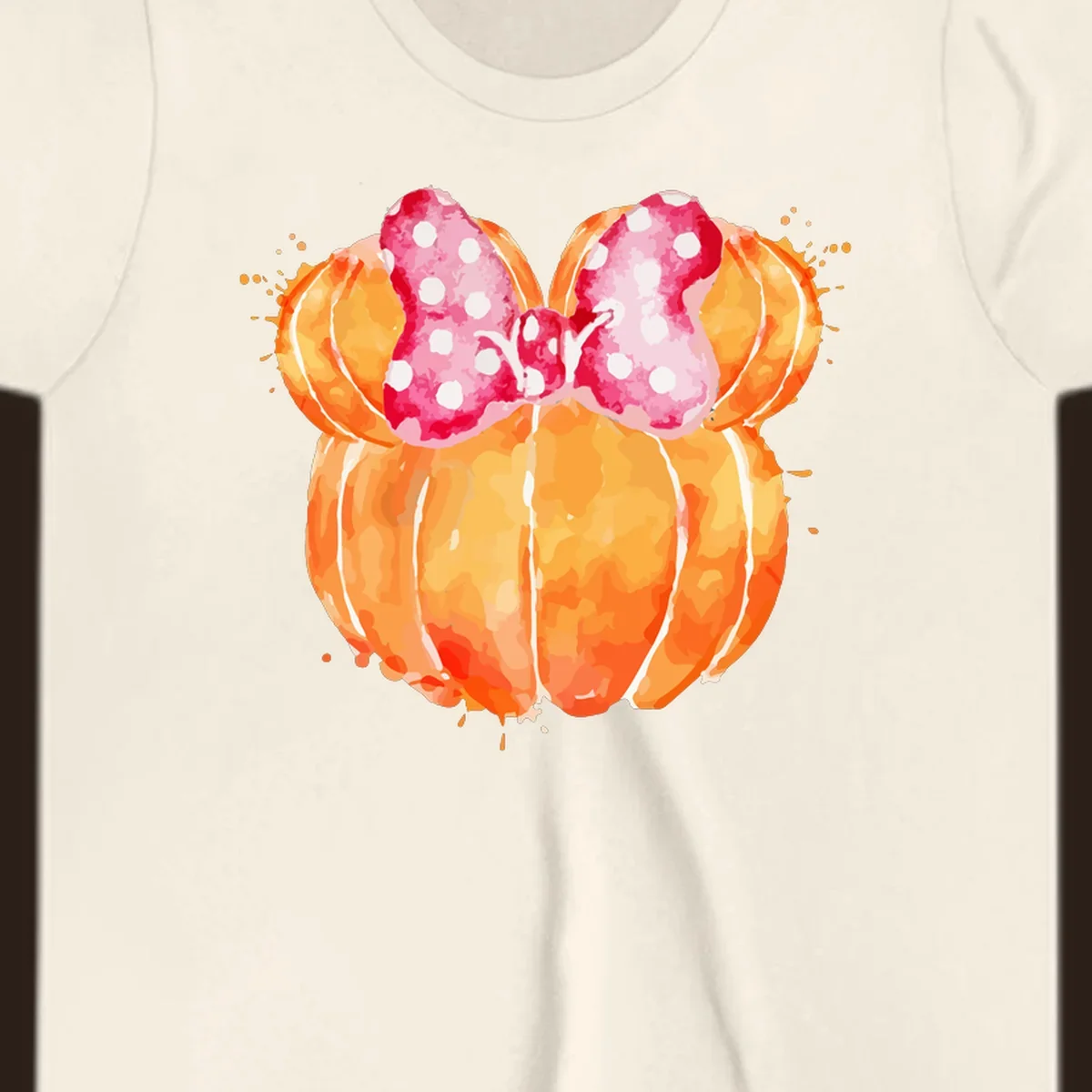 Watercolor illustration of two orange pumpkins shaped like Minnie Mouse ears with a pink polka dot bow.
