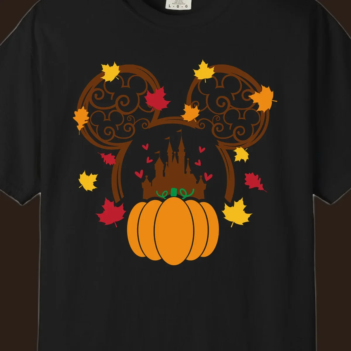 Disney fall pumpkin castle Mickey ears design with autumn leaves.