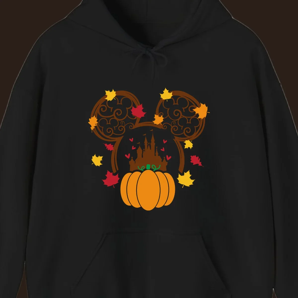 Disney fall pumpkin castle Mickey ears design with autumn leaves.