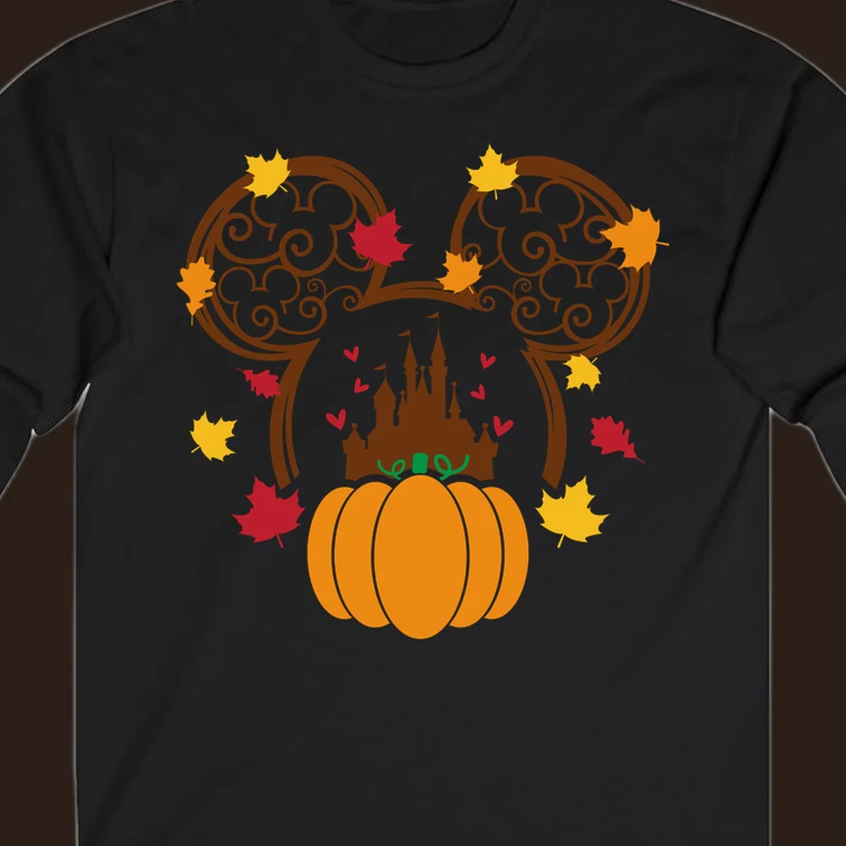 Disney fall pumpkin castle Mickey ears design with autumn leaves.