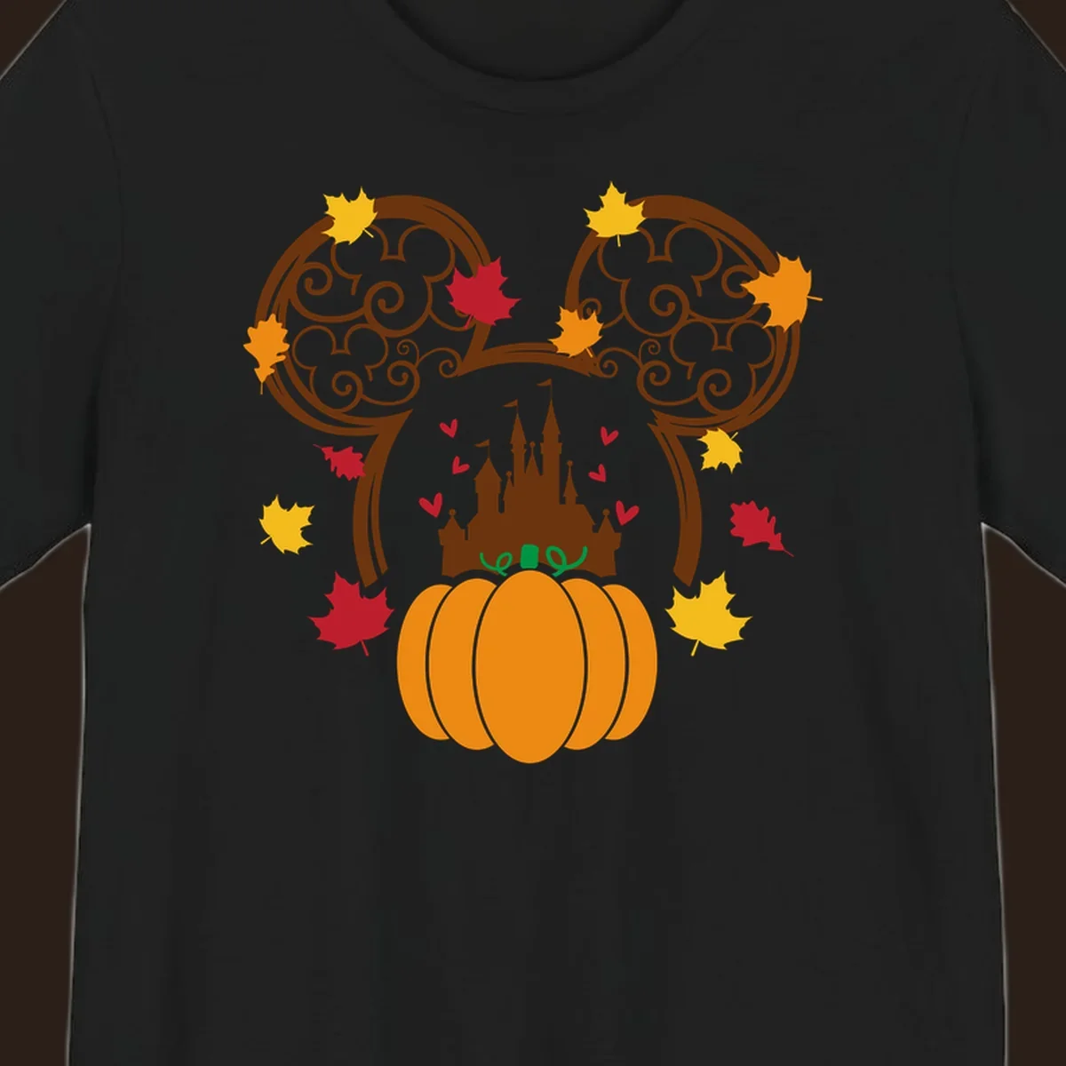 Disney fall pumpkin castle Mickey ears design with autumn leaves.