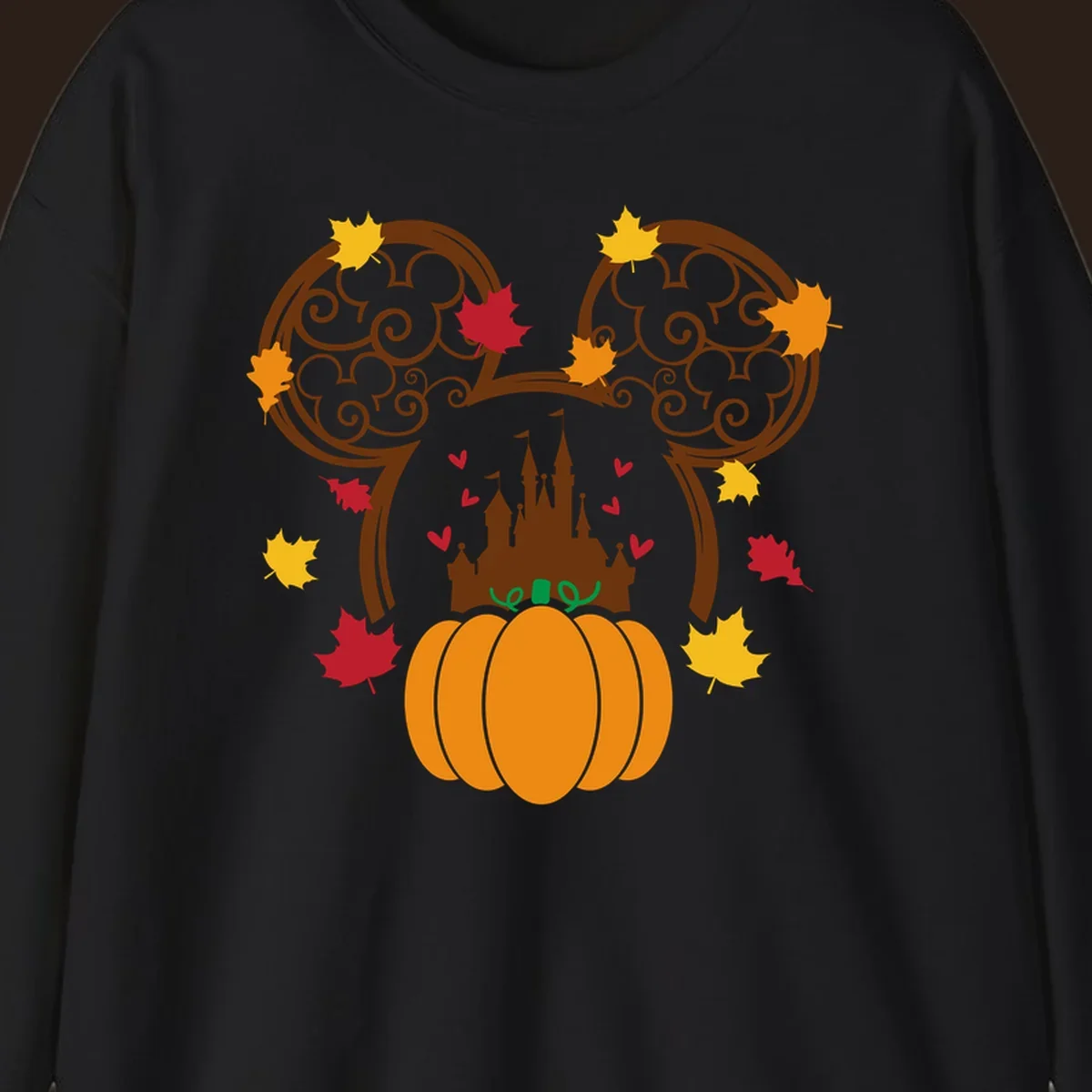 Disney fall pumpkin castle Mickey ears design with autumn leaves.