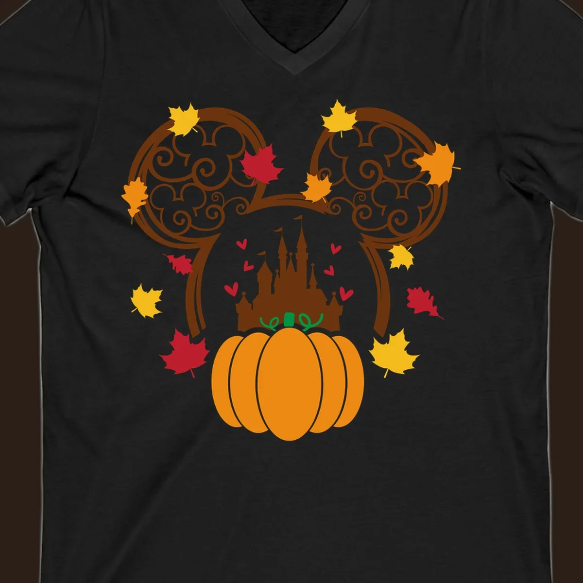 Disney fall pumpkin castle Mickey ears design with autumn leaves.